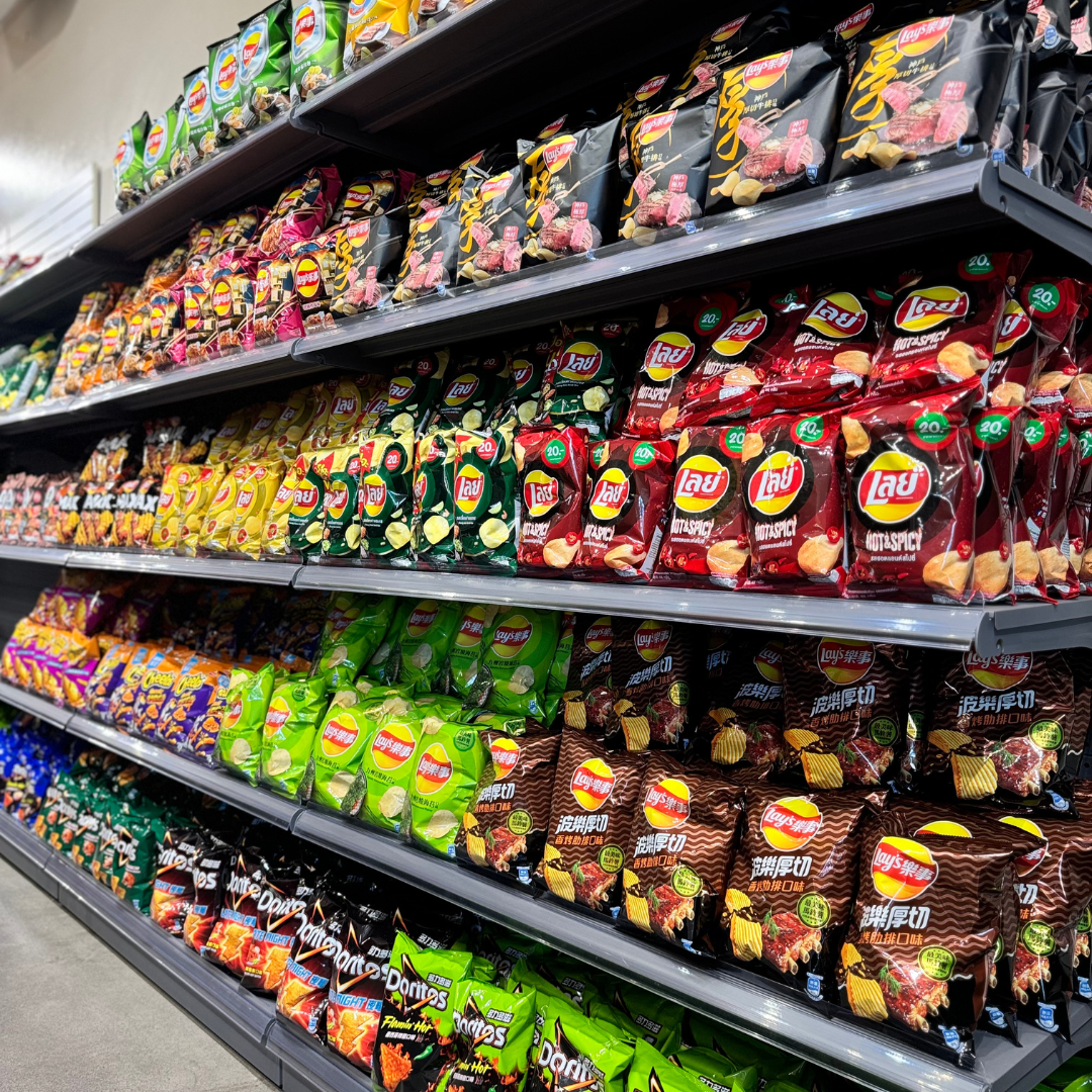 A grocery shelf packed with various snack bags